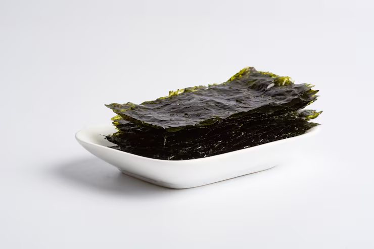 Roasted gim sheets on a white dish