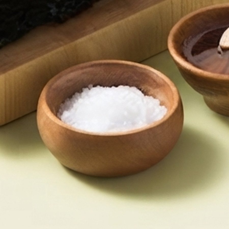 Coarse sea salt in a wooden bowl
